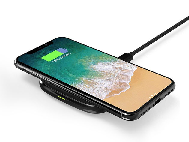 A charging pad with a phone on it