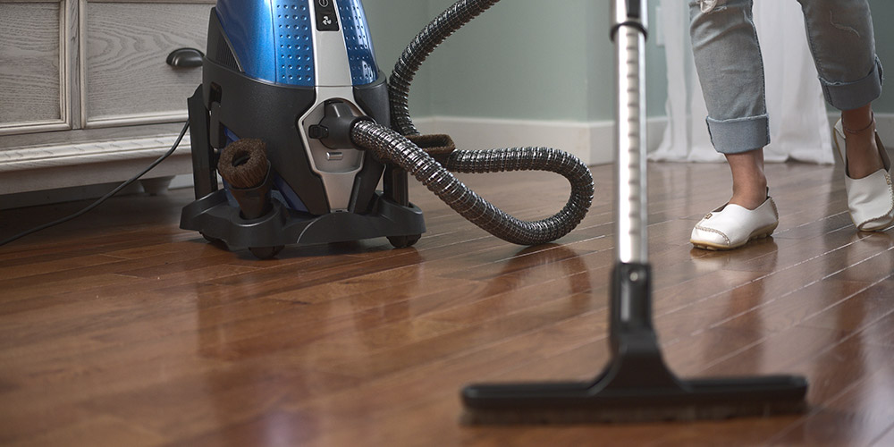 Woman vacuuming floor