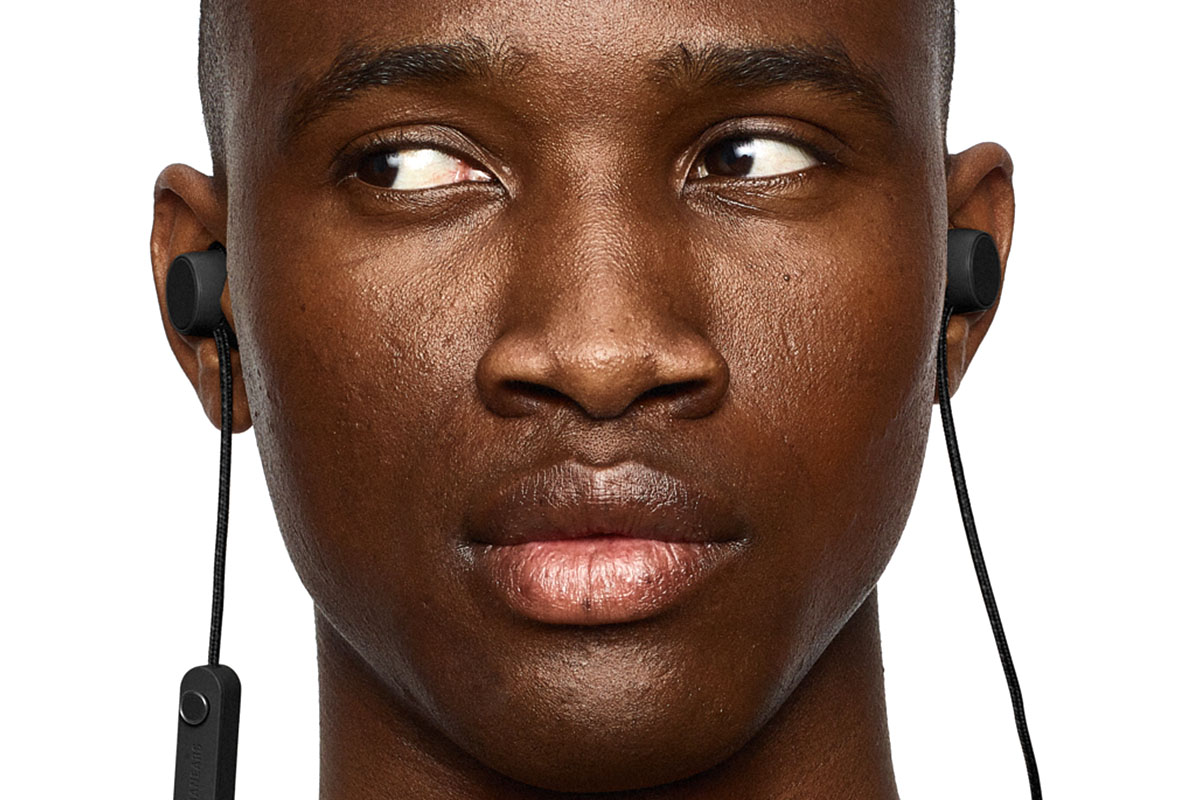 A person wearing Urbanears ear phones