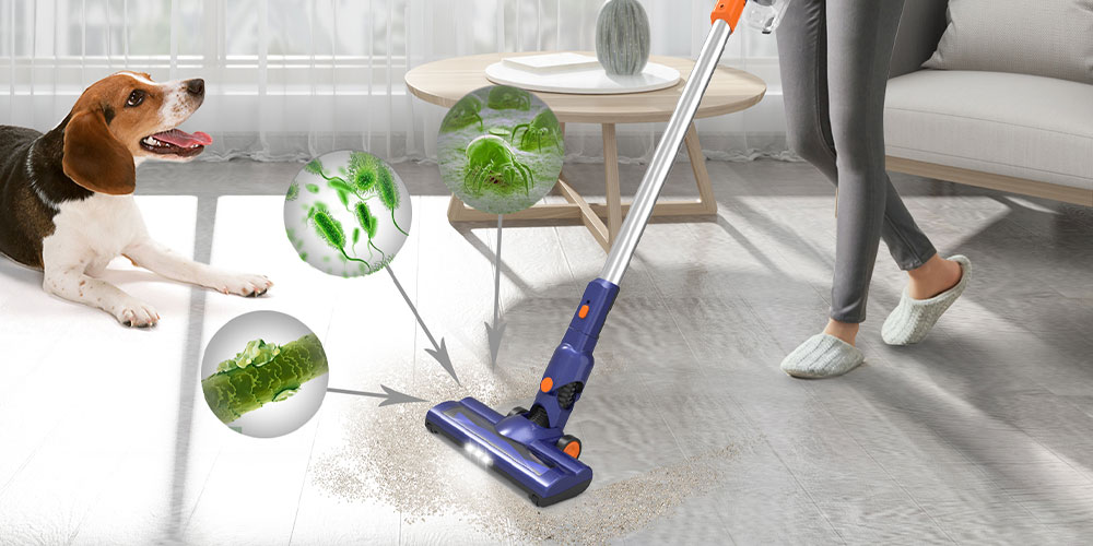 Woman using vacuum by dog and coffee table